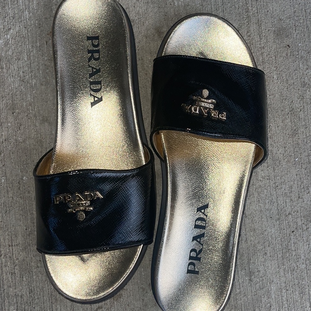 PRADA Black leather slides with gold sole